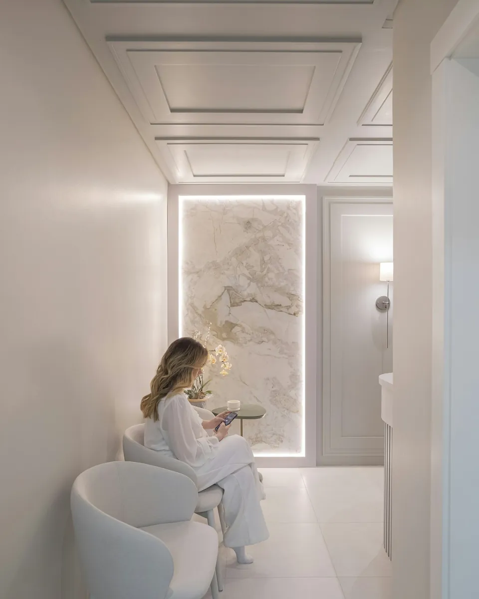Calm, modern patient waiting lounge at a private medical center in Qatar